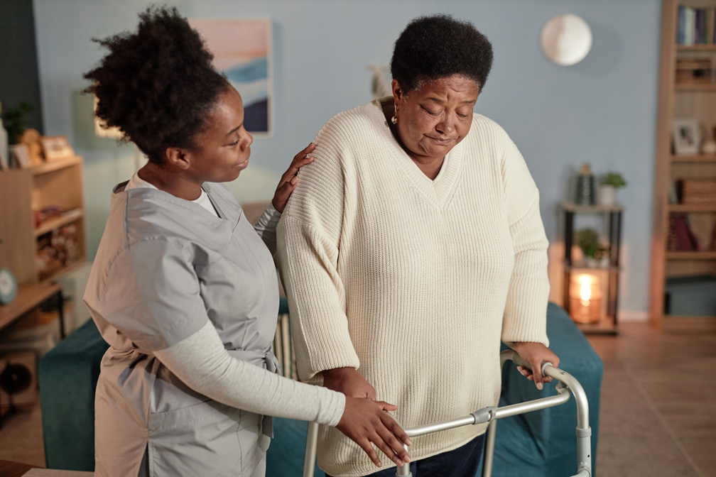 Caregiver assisting senior in wheelchair